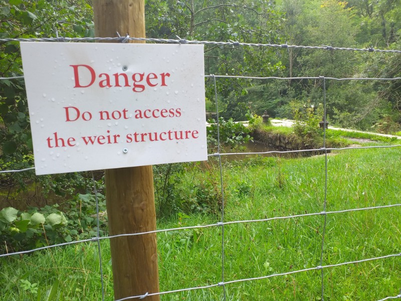 Fencing sealing off access to the the weir in the Monsal valley