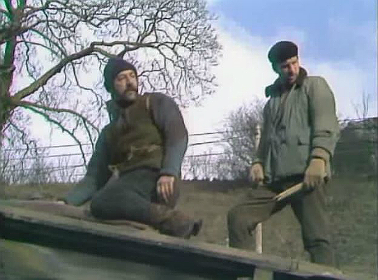 Sanders and Jim - repairing the roof - in Mad Dog